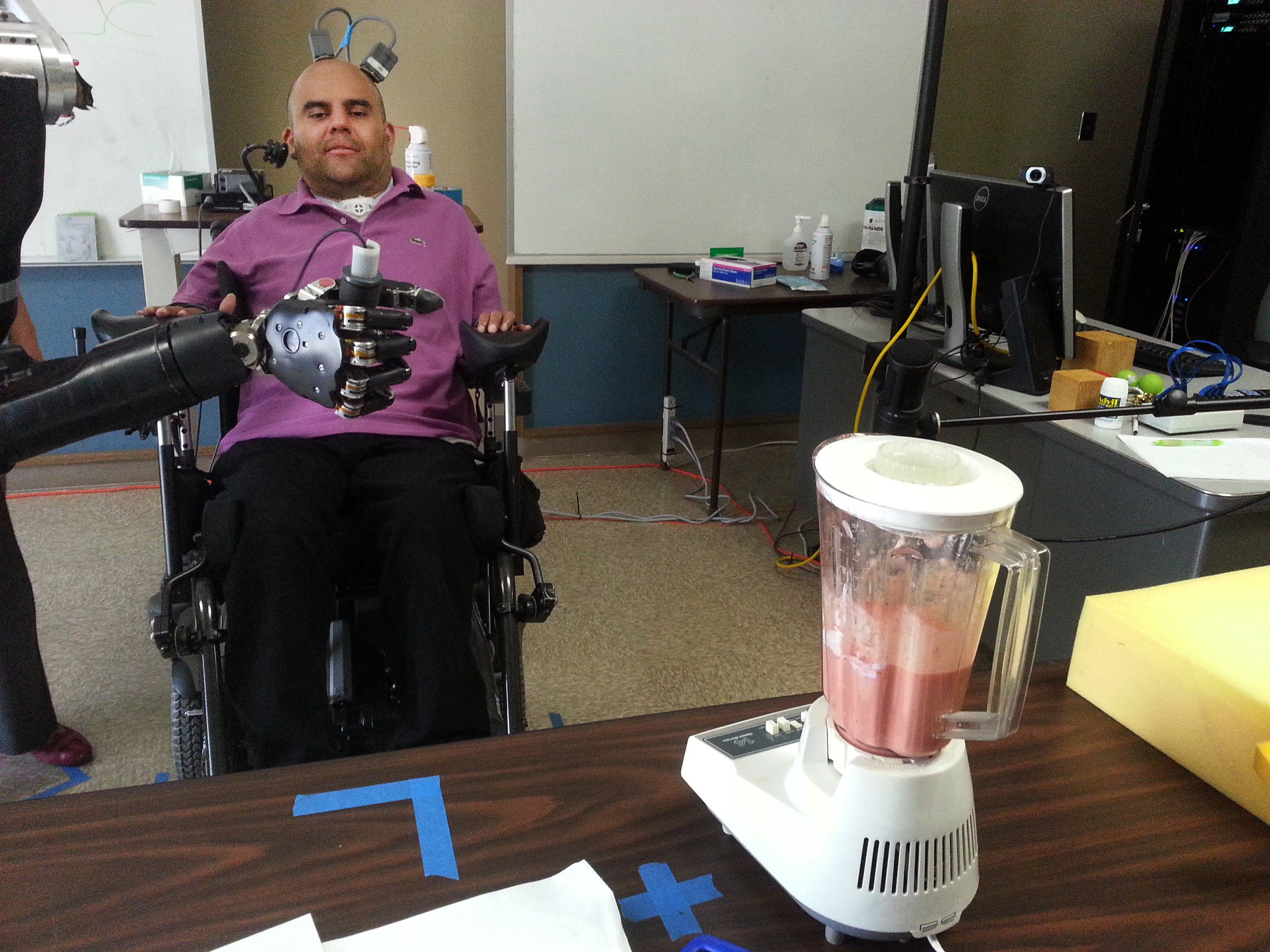 Paralyzed man uses his thoughts to control a robotic arm