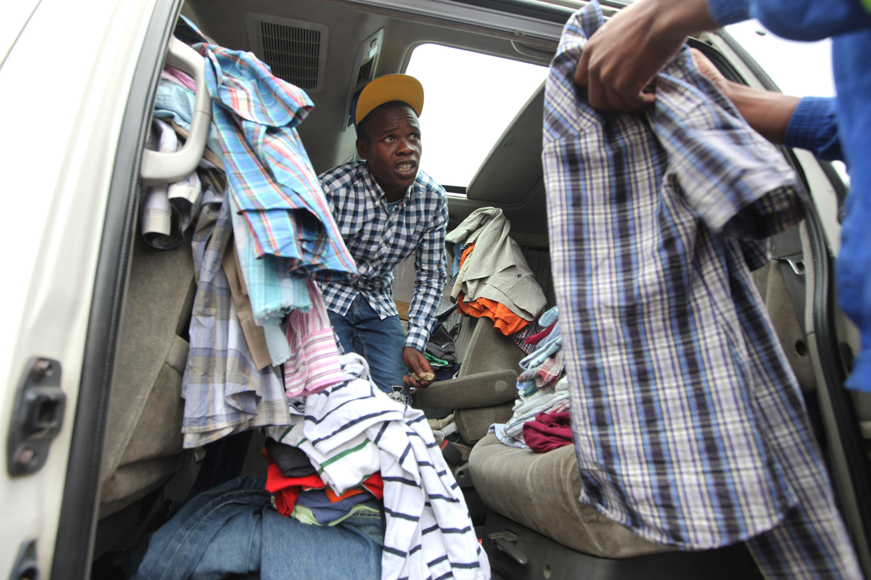 Outfits on wheels: In Zimbabwe, cars are used clothing shops