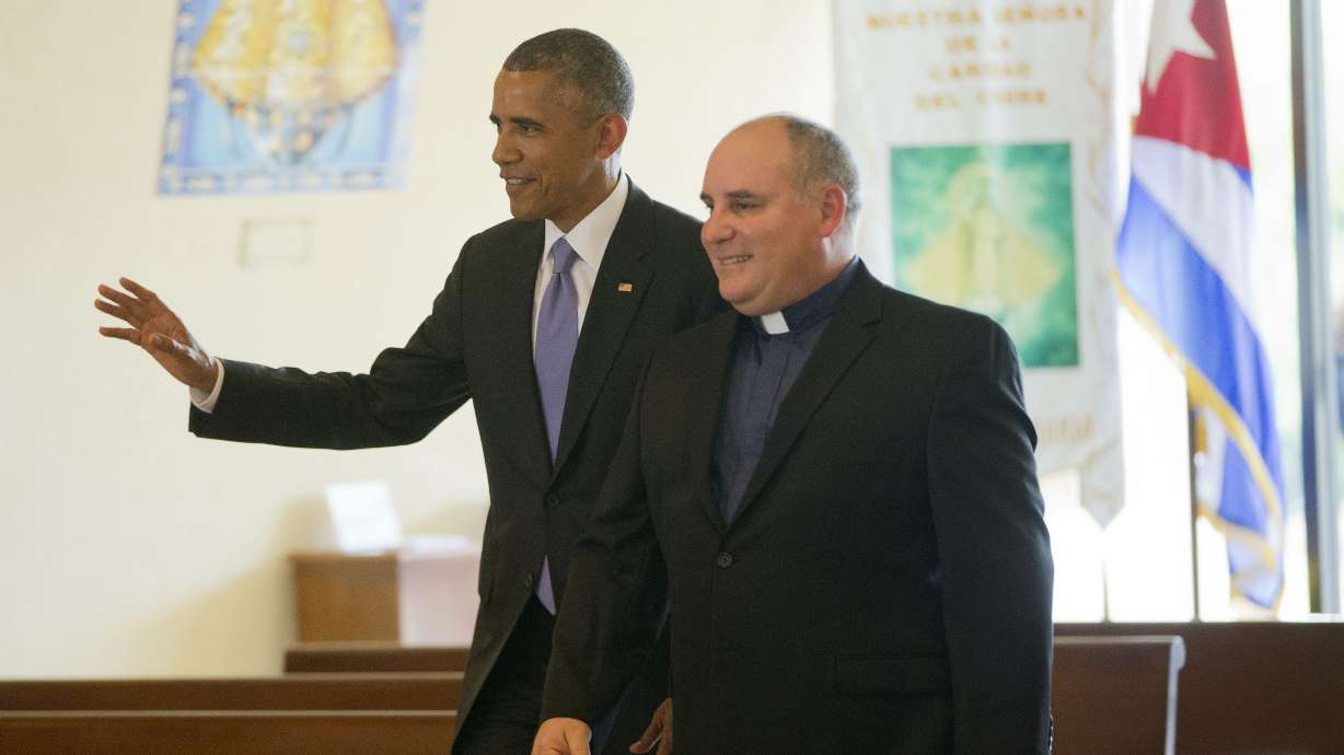 Obama visits shrine to honor Cuban Americans