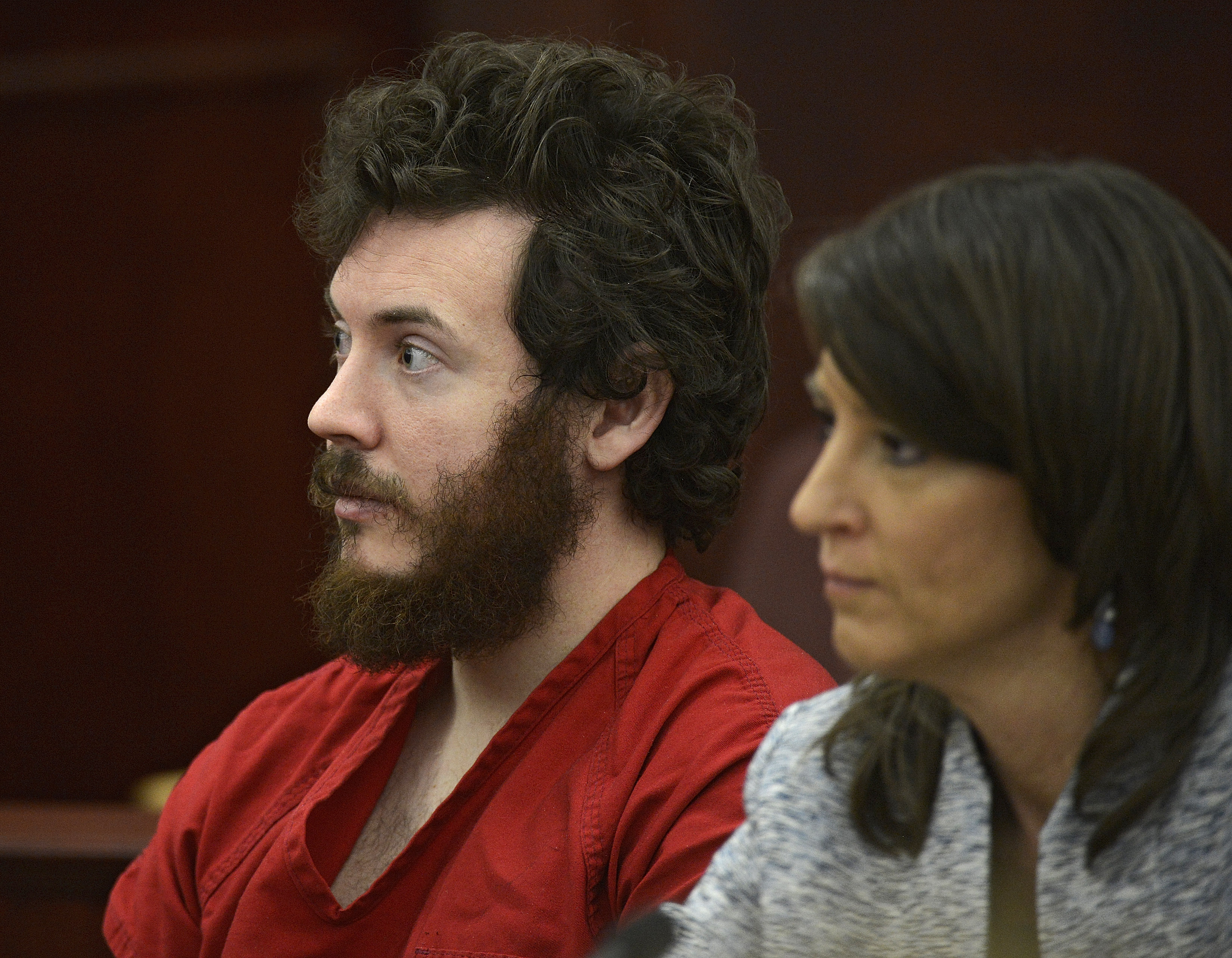 The Latest: James Holmes says God would care about shootings