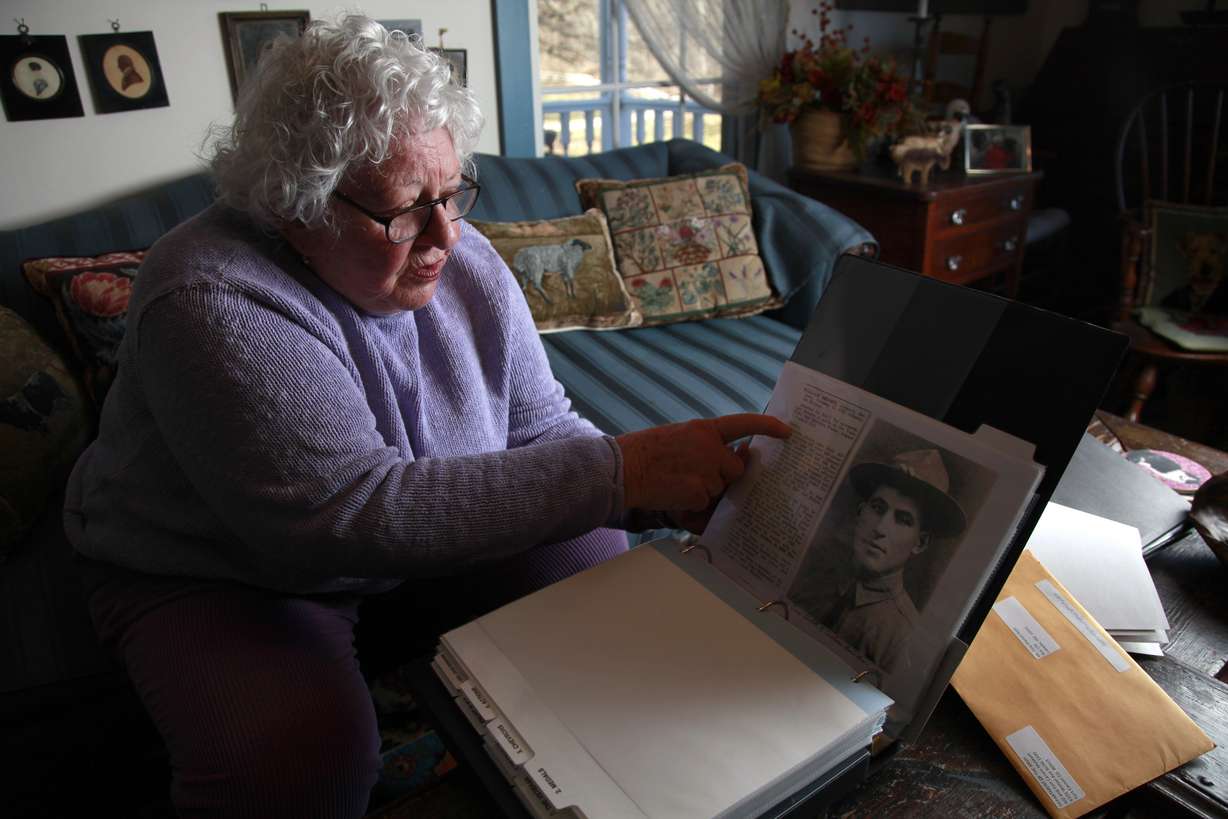 In this Jan. 5, 2012, file photo, Elsie Shemin-Roth flips through a book documenting the heroic acts of her father, William Shemin, during World War I, at her home in Labadie, Mo. Two World War I Army heroes, Shemin and Pvt. Henry Johnson are finally getting the Medal of Honor they may have been denied because of discrimination, nearly 100 years after bravely rescuing comrades on the battlefields of France. President Barack Obama plans to posthumously bestow the nation's highest military honor on both men for their actions in 1918 during a White House ceremony Tuesday, June 2, 2015. (AP Photo/Jeff Roberson, File)