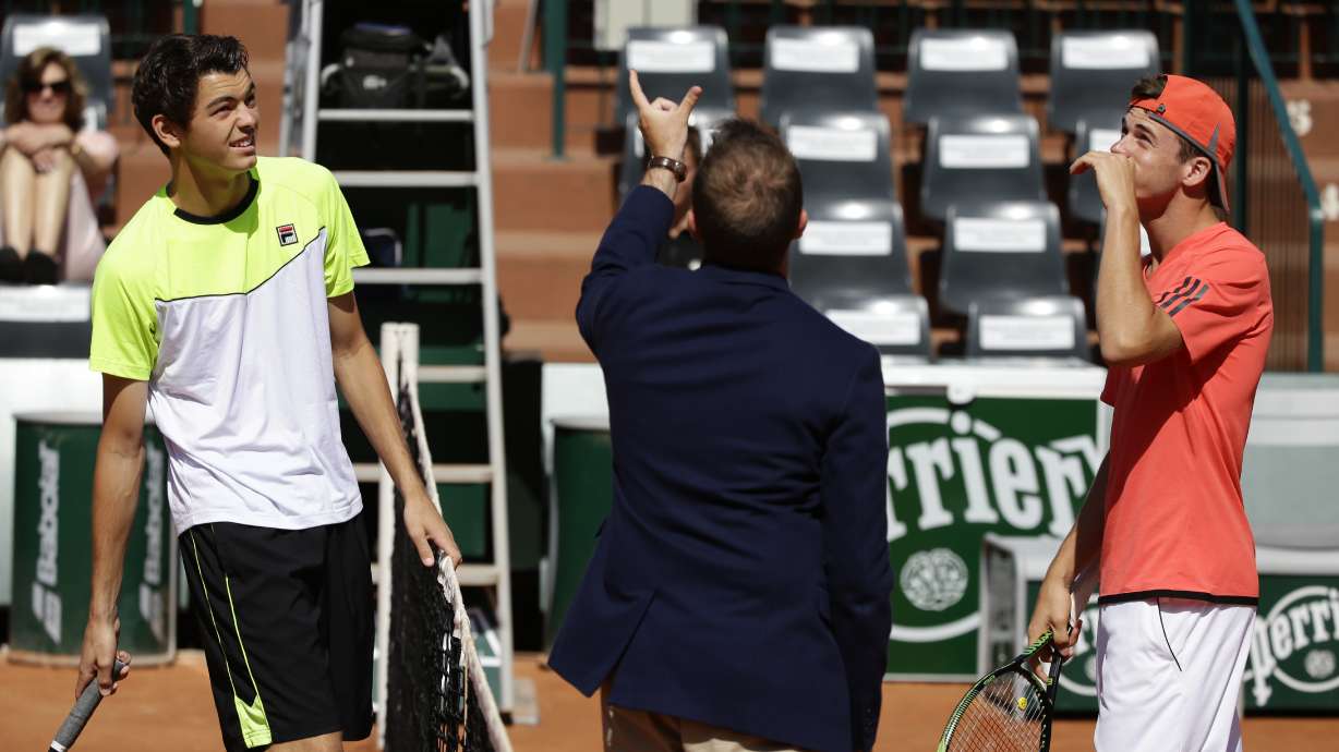 The Latest: Dodig, Melo win French Open men's doubles title