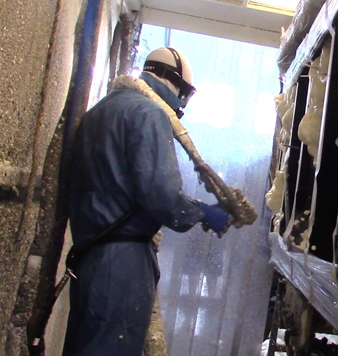 One of the stages of production includes foam installation. This worker can be seen spraying foam inside the walls of the spa shell. (Photo: Jen Jacobson)