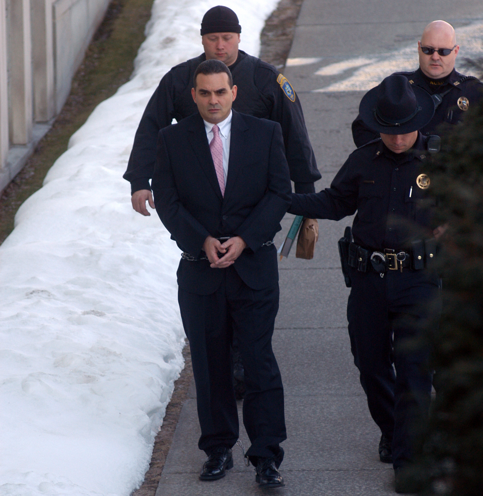 Hunt for killers expands to Vermont; staffer under suspicion