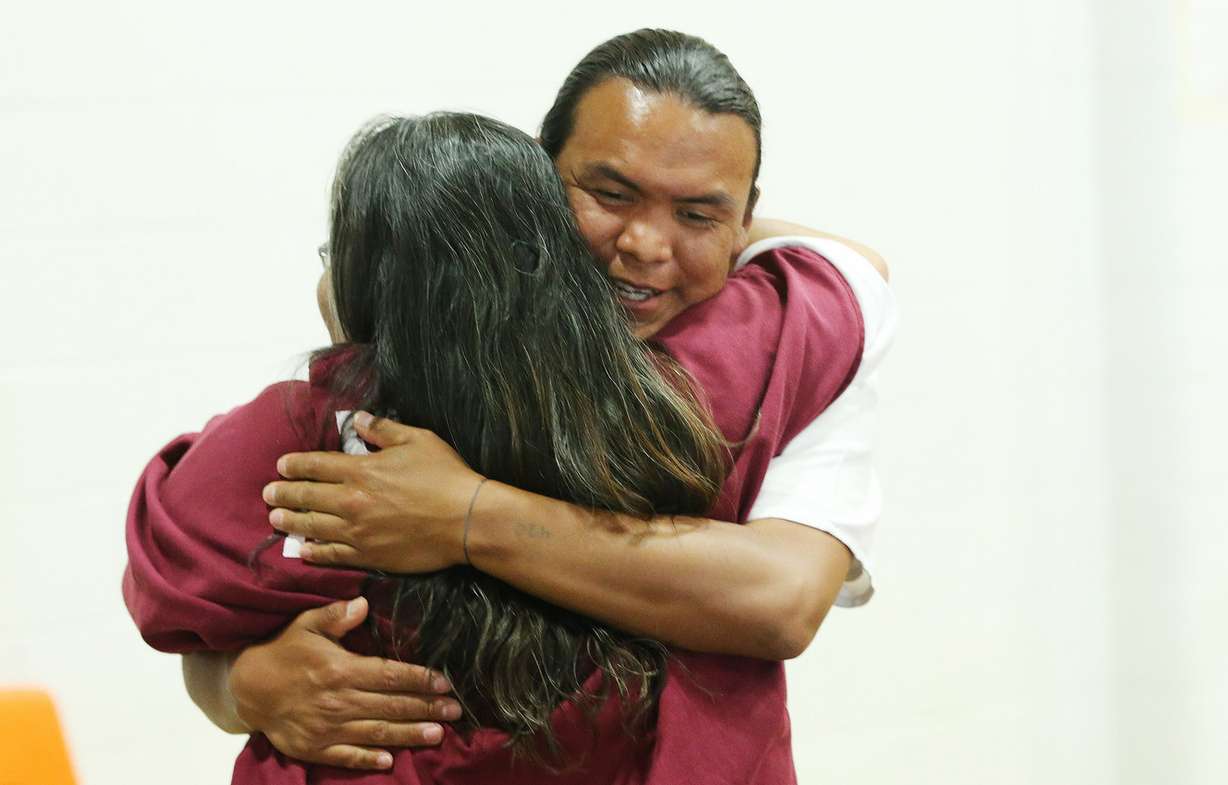 Zechariah Curley hugs his mother, Genevieve Billie, as they and other Utah State Prison inmates receive high school diplomas during graduation exercises in Draper Wednesday, June 10, 2015. (Photo: Jeffrey D. Allred, Deseret News)