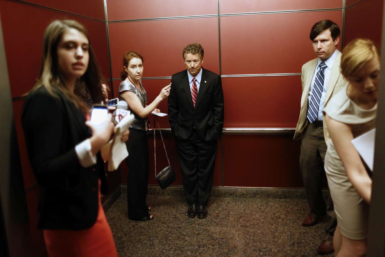 Sen. Rand Paul, R-Ky. rides in an elevator with reporters and staff members after he spoke at the Faith and Freedom Coalition Road to Majority Conference in Washington, Thursday, June 13, 2013. The fight for the direction of the Republican Party will be on display Thursday at a Washington conference hosted by the Faith and Freedom Coalition, a group created by former Christian Coalition leader Ralph Reed. Designed to strengthen the evangelical influence in national politics, the conference gives many religious conservative activists their first look at potential 2016 presidential candidates. (AP Photo/Charles Dharapak)