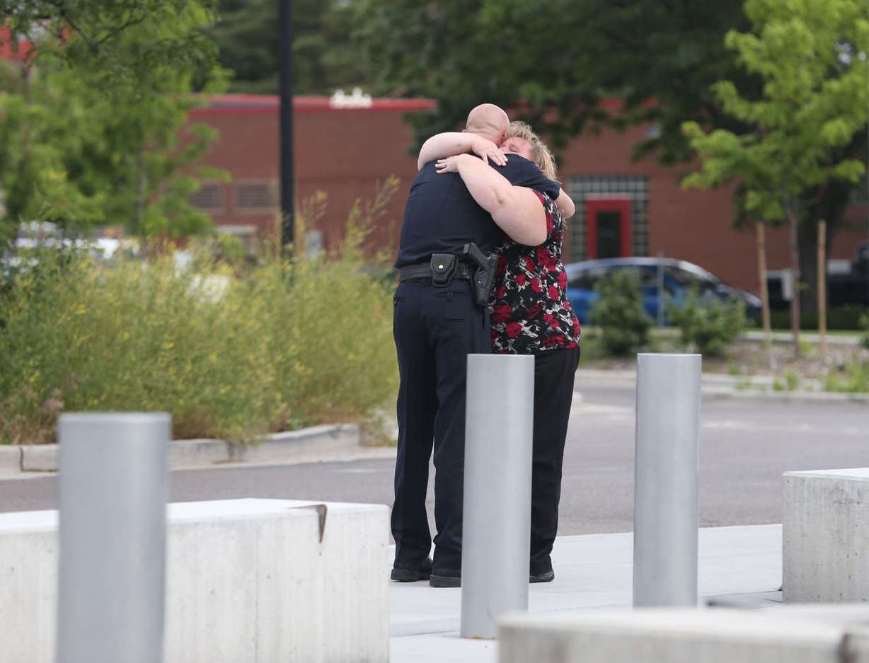 Former Salt Lake City Police Chief Chris Burbank receives a hug from an employee after speaking to the media about his resignation at the Public Safety Building in Salt Lake City on Thursday, June 11, 2015. (Laura Seitz/Deseret News)
