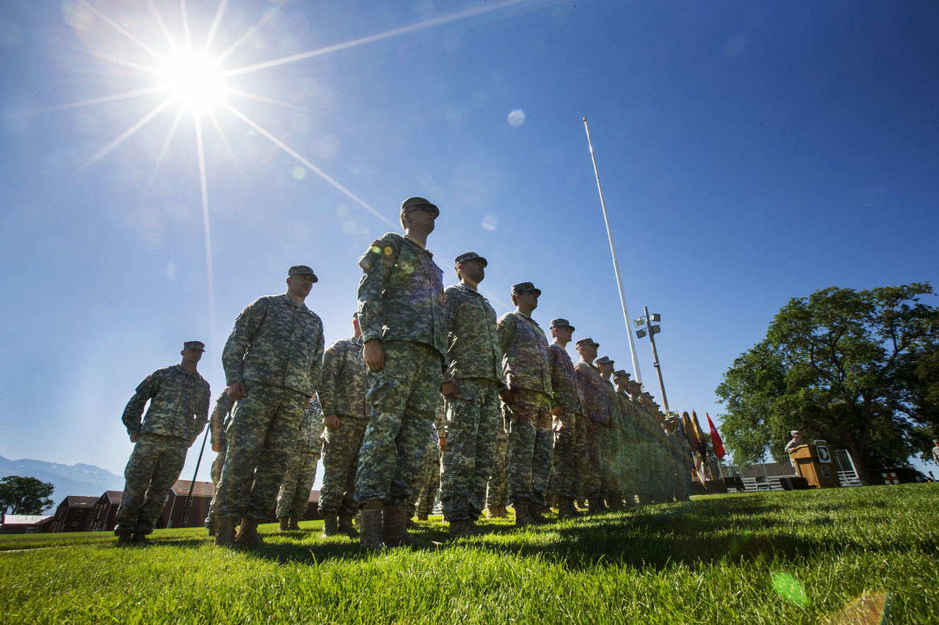 Members of the Utah National Guard 300th Military Intelligence Brigade realign into the 101st Airborne Division Friday, June 19, 2015, during an "Old Abe" patch ceremony on Tarbet Field at Camp Williams. (Photo: Scott G Winterton, Deseret News)