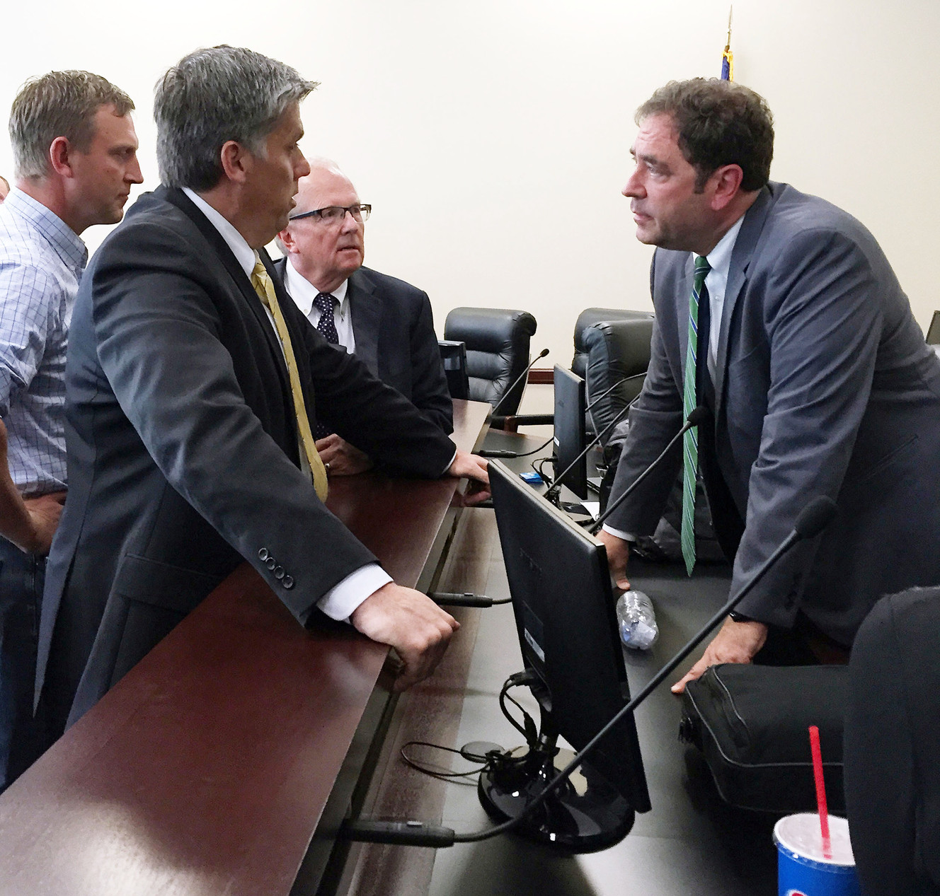 San Juan County Commissioner Phil Lyman, Rep. Mike Noel, R-Kanab, and Rep. Brian King, D-Salt Lake City, talk after Constitutional Defense Council meeting in Salt Lake City, Wednesday, June 24, 2015. (Photo: Dennis Romboy, Deseret News)
