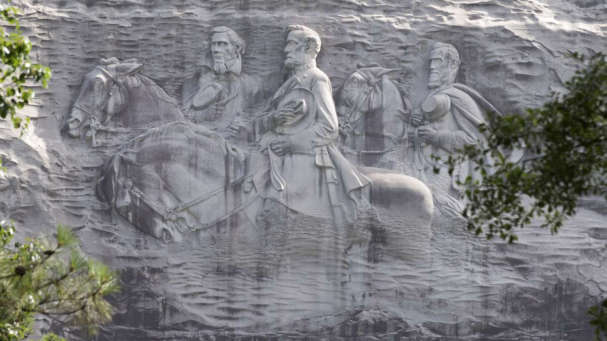 Stone Mountain Park official: Rebel flags must fly under law