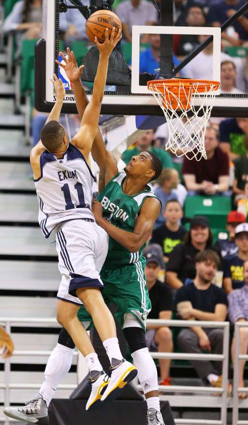 Utah's Dante Exum goes hard to the basket and is fouled by Jordan Mickey as the Utah Jazz and the Boston Celtics play Monday, July 6, 2015, in Summer League action at EnergySolutions Arena in Salt Lake City Utah. (Photo: Scott G Winterton/Deseret News)