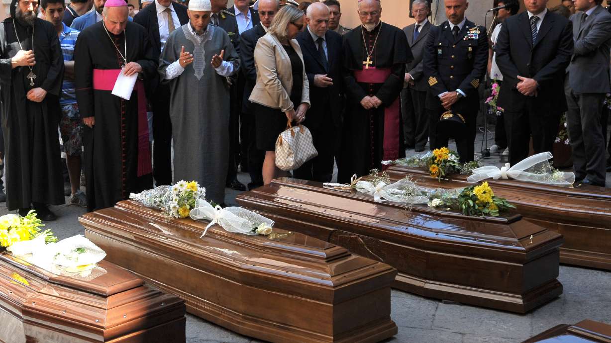 13 coffins: Italy buries 1st bodies from migrant shipwreck