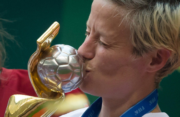 United States' Megan Rapinoe kisses the trophy after defeating Japan to win the FIFA Women's World Cup soccer championship in Vancouver, British Columbia, Canada, Sunday, July 5, 2015. (DARRYL DYCK/The Canadian Press via AP)