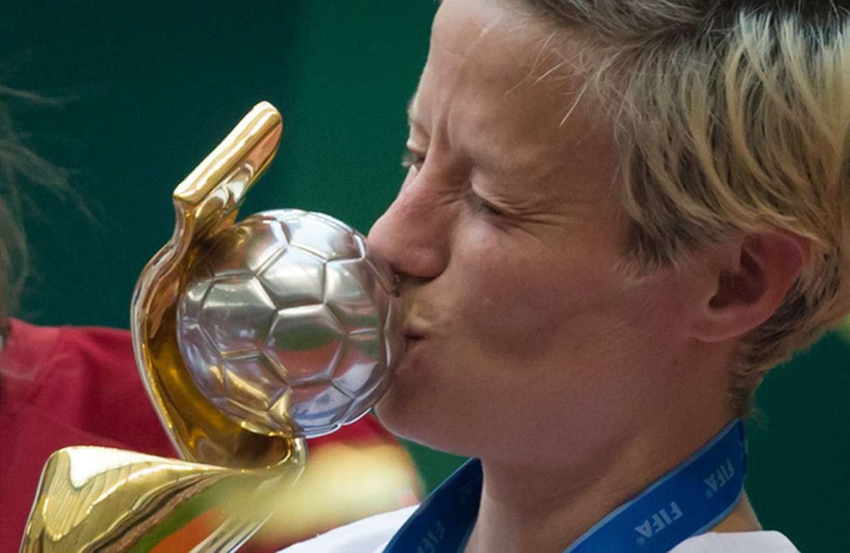 United States' Megan Rapinoe kisses the trophy after defeating Japan to win the FIFA Women's World Cup soccer championship in Vancouver, British Columbia, Canada, Sunday, July 5, 2015. (DARRYL DYCK/The Canadian Press via AP)