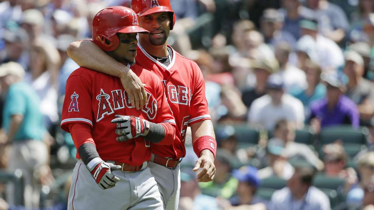 Angels move into 1st place in AL West, beat Seattle 10-3