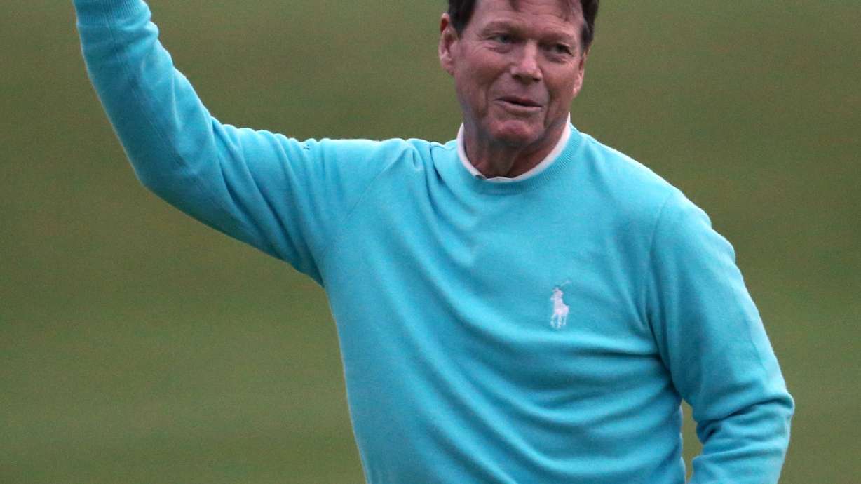 Farewell: Watson crosses Swilcan Bridge for final time