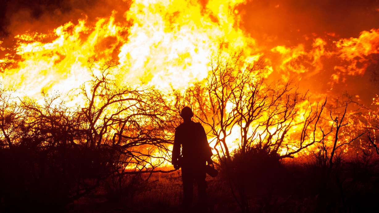 Rain calms California fire that jumped freeway, burned cars