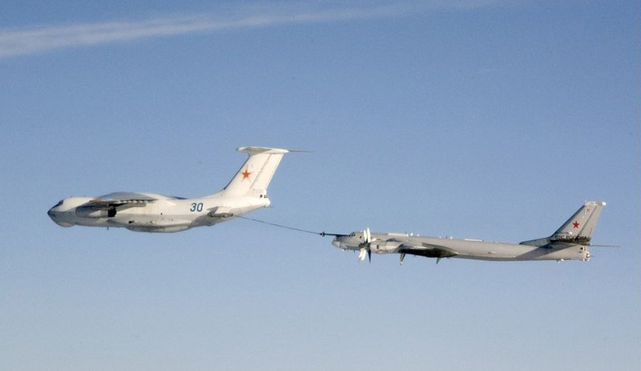A Russian Il-78 tanker refuels a Tu-95 Bear bomber in a photograph taken by a Norwegian warplane. Photo: Norweigan Armed Forces