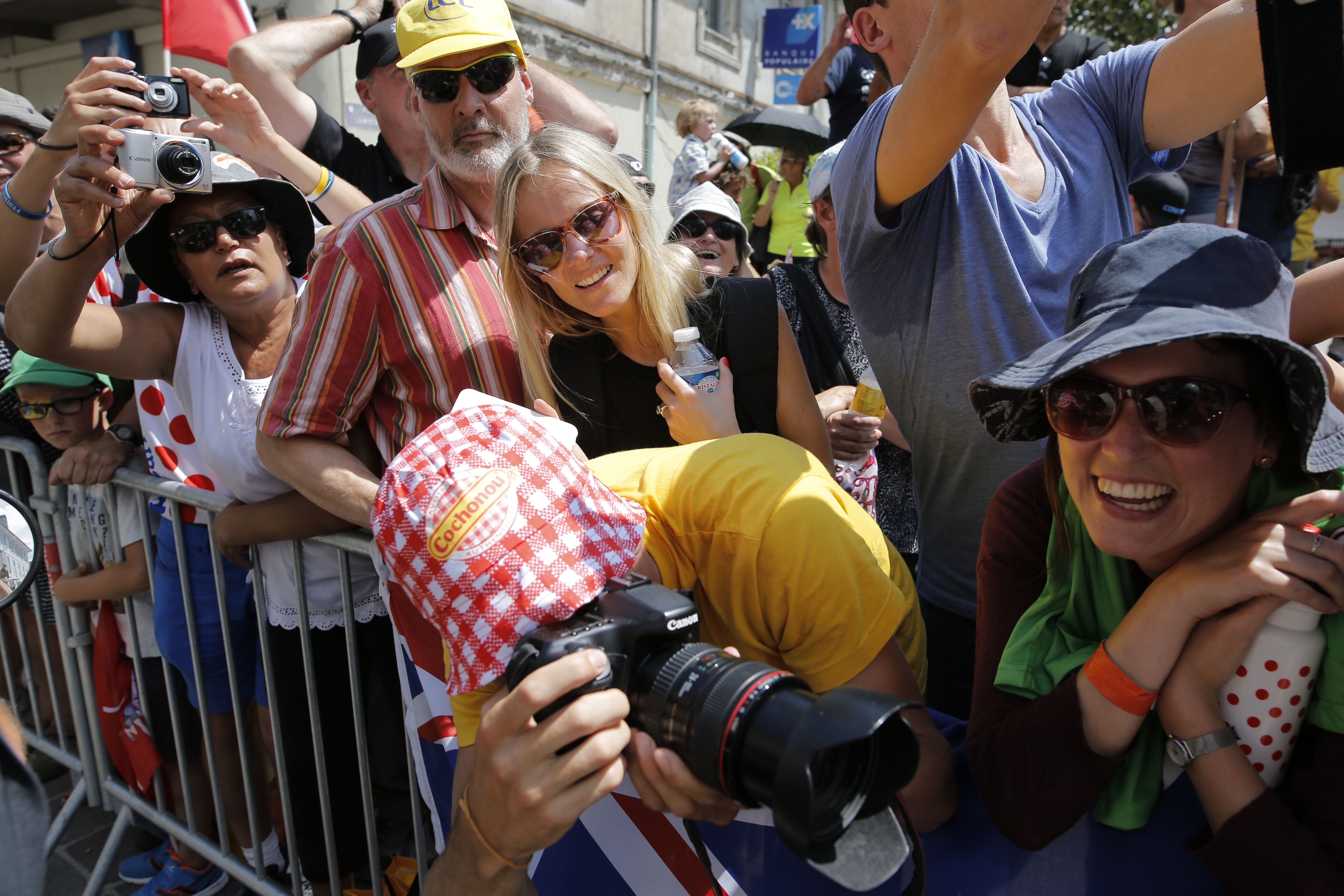 The Latest: Froome earns Tour best-climber jersey too