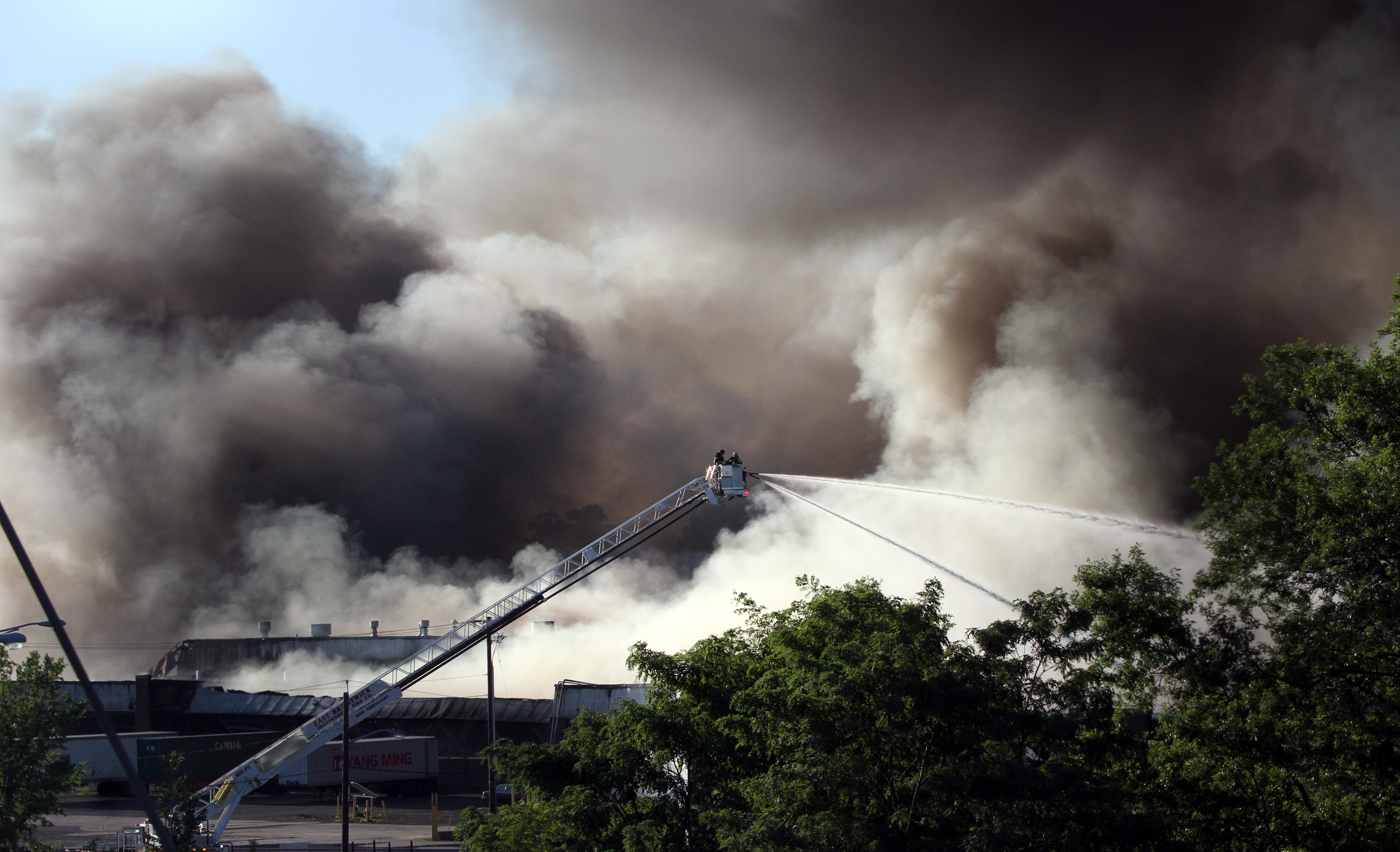 Residents evacuated by huge warehouse fire can return home