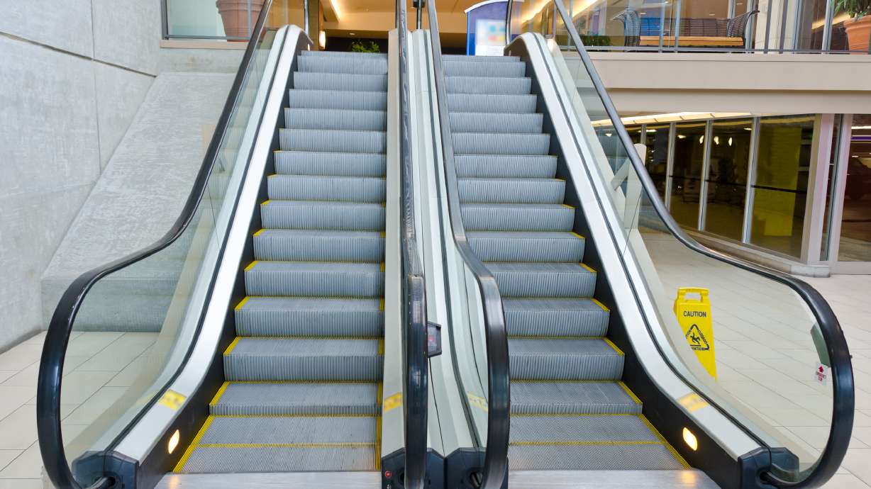 Chinese woman dies after trapped in escalator, but saves son