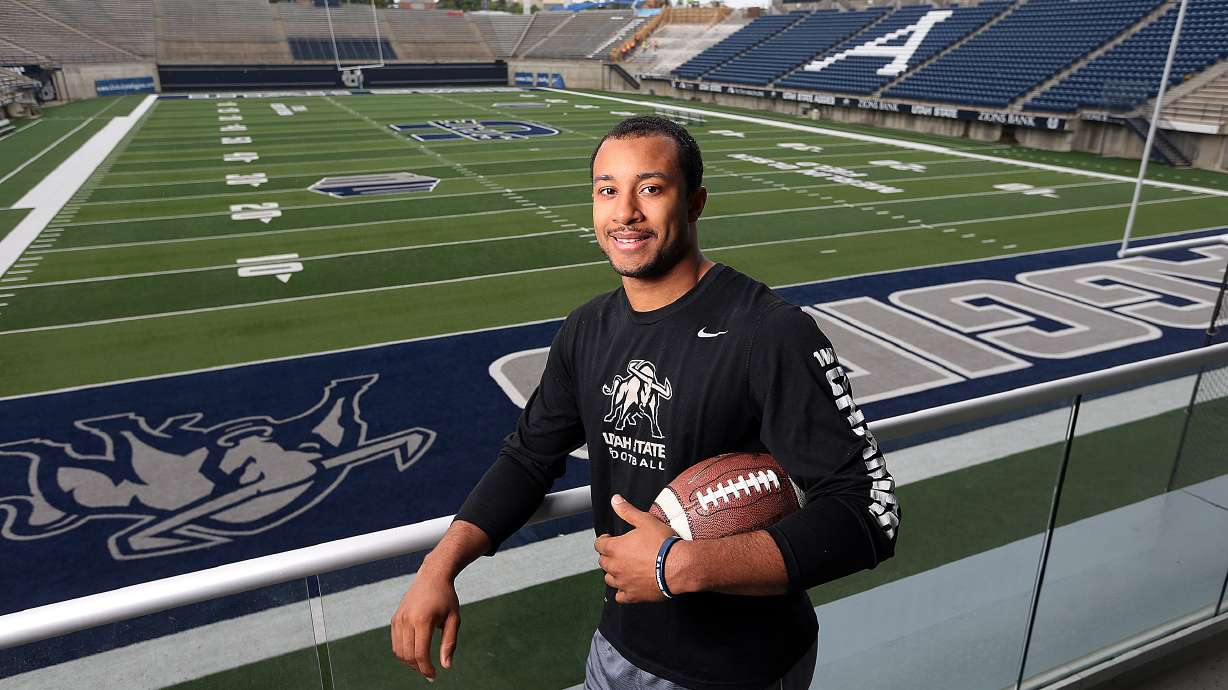 Utah State quarterback Chuckie Keeton poses for a picture at Maverik Stadium in Logan, Utah.