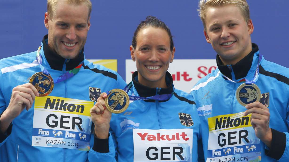 Russia beats US for synchro mixed duet gold at worlds