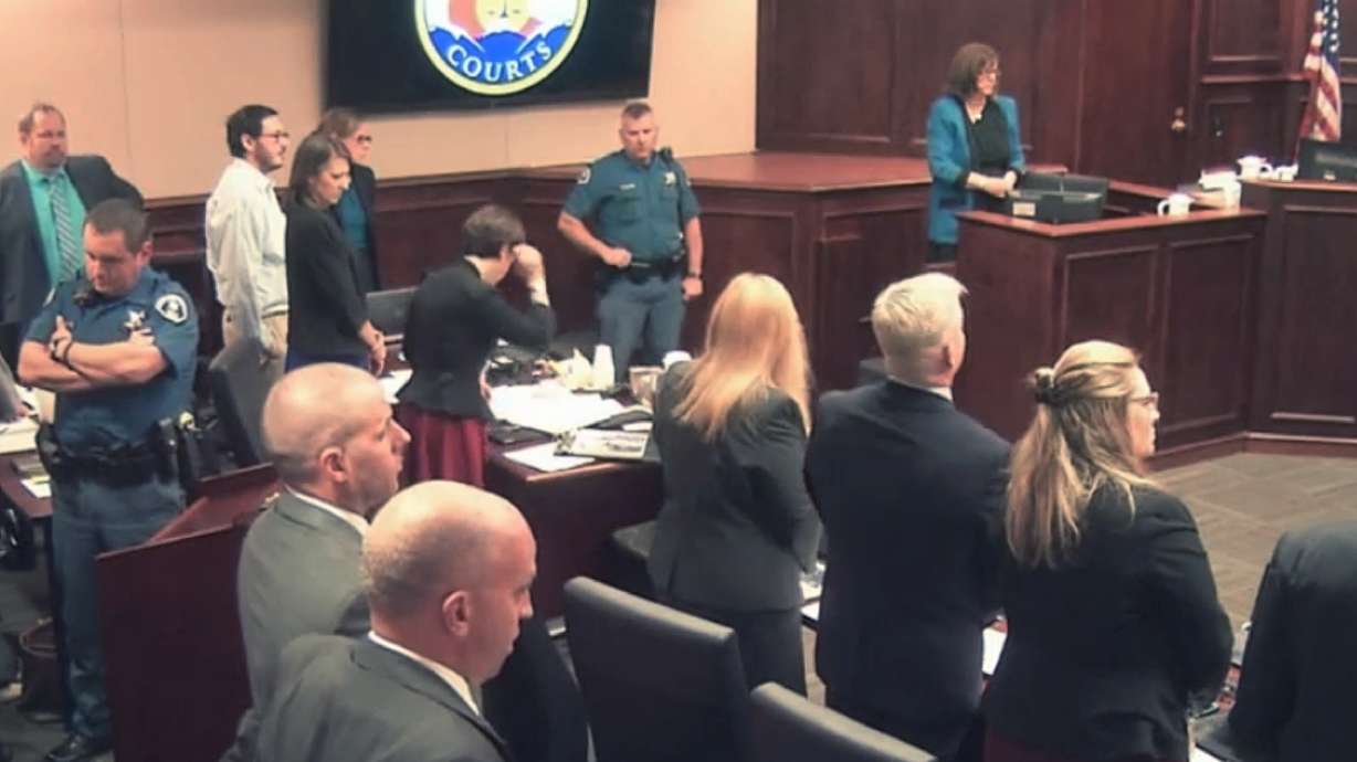 The Latest: Colorado shooting judge holds woman in contempt