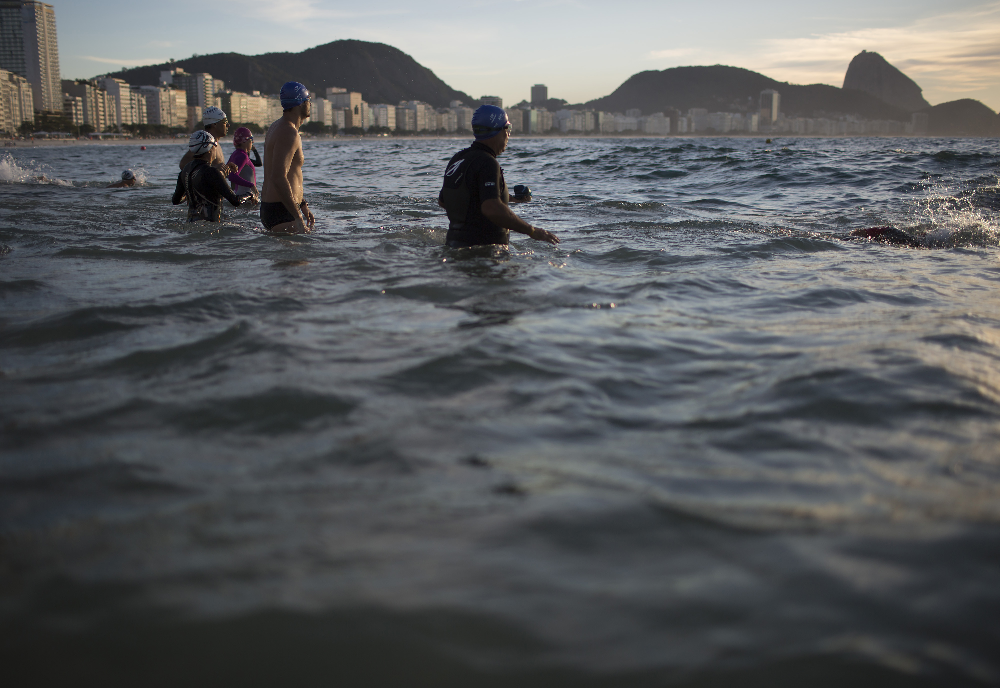 Triathletes shrug off water warnings, swim in Rio