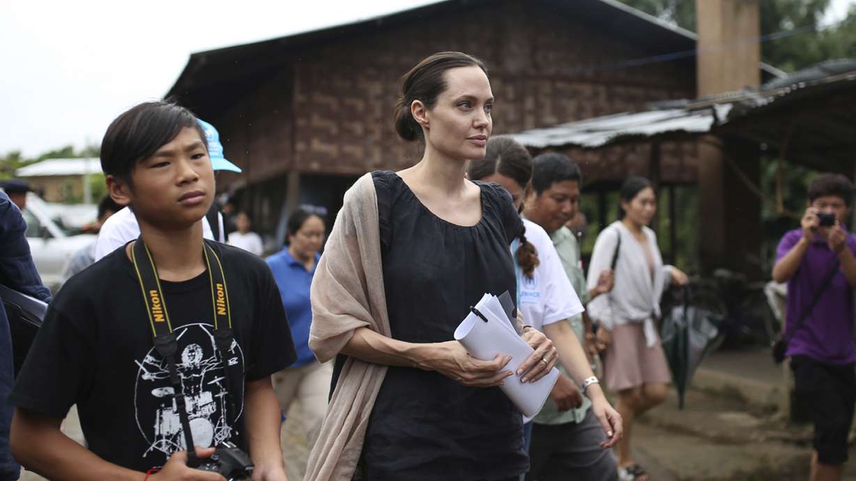 Jolie, Suu Kyi visit Myanmar female factory workers