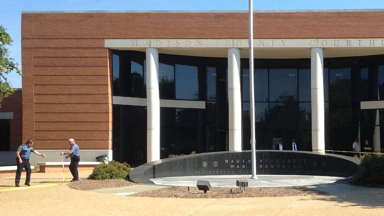 The Latest: Courthouse shooting suspect involved in fight