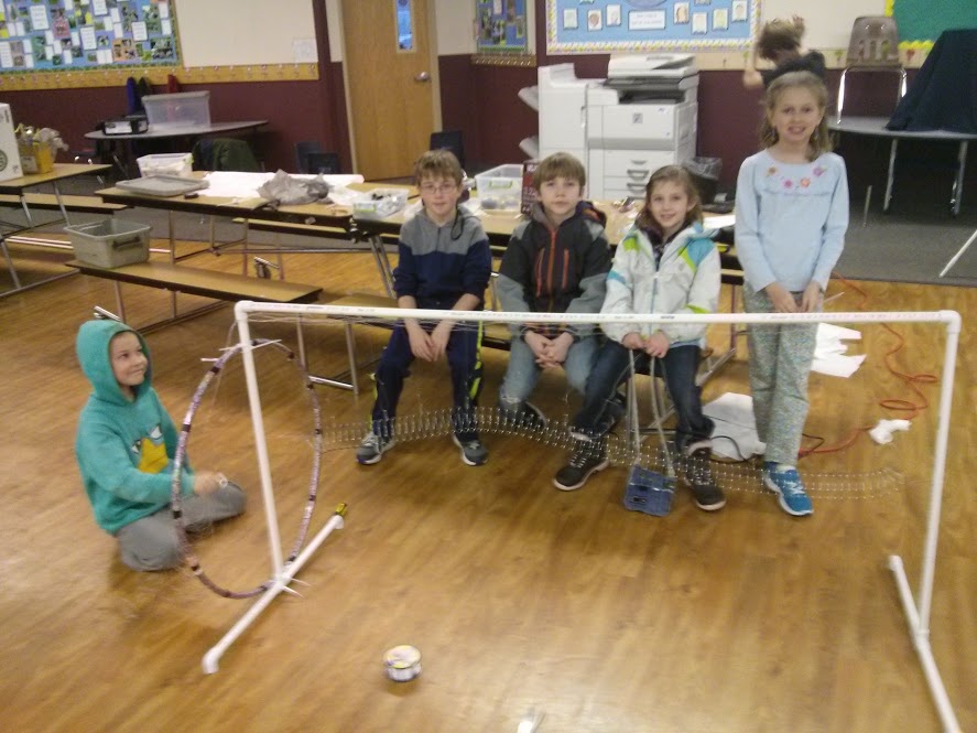 The Smart Alecks show a device they built to teach how waves work as part of their project. (Photo: Brian Ivie)