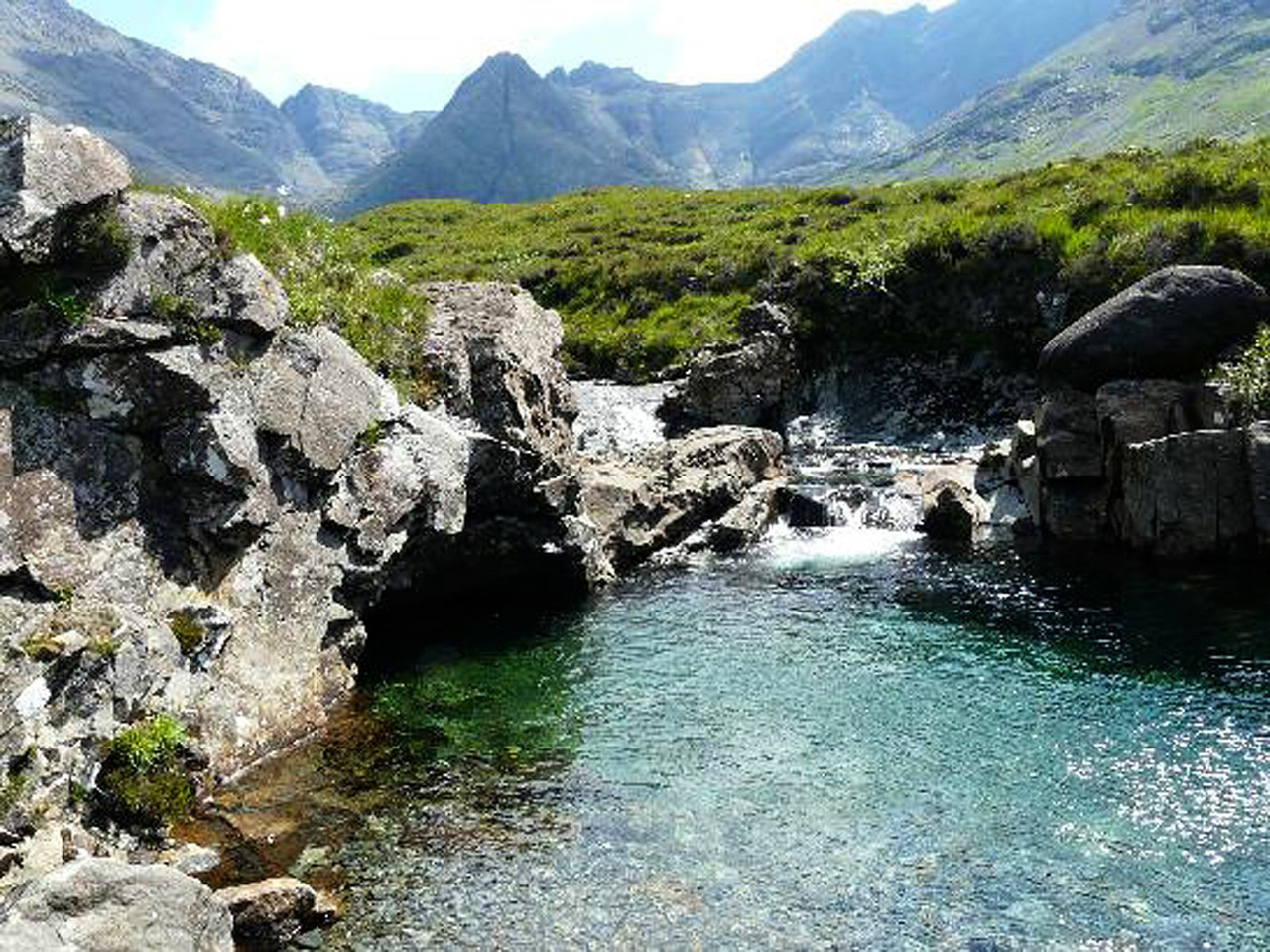 Fairy Pools, Isle of Skye, Scotland. Located at Glen Brittle in Scotland, Fairy Pools is a series of aquamarine pools fed by scenic — and icy cold — waterfalls streaming down from the Cuillin mountains. (Photo: Trip advisor Traveler)