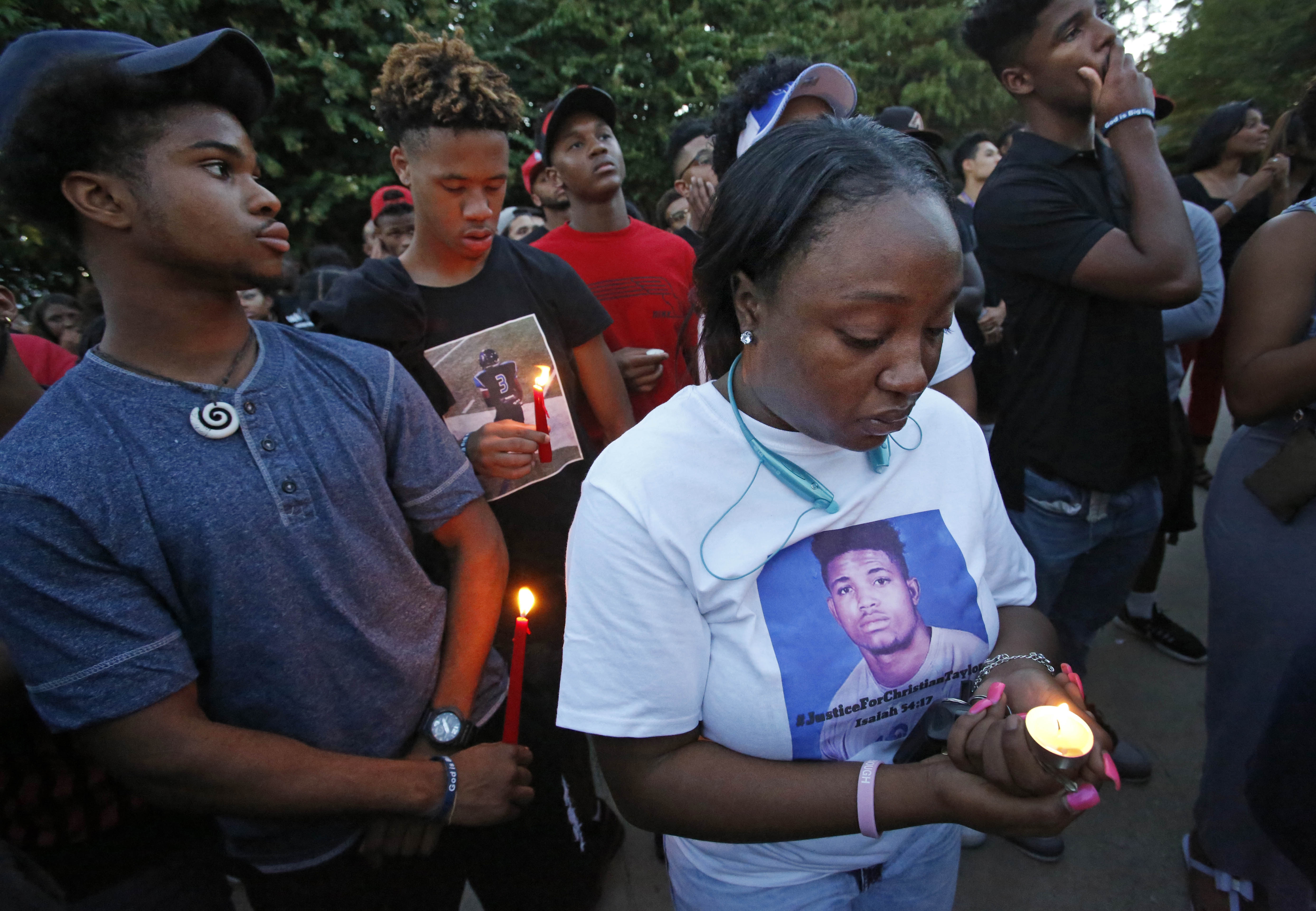 The Latest on athlete's death: Dozens demonstrate in protest