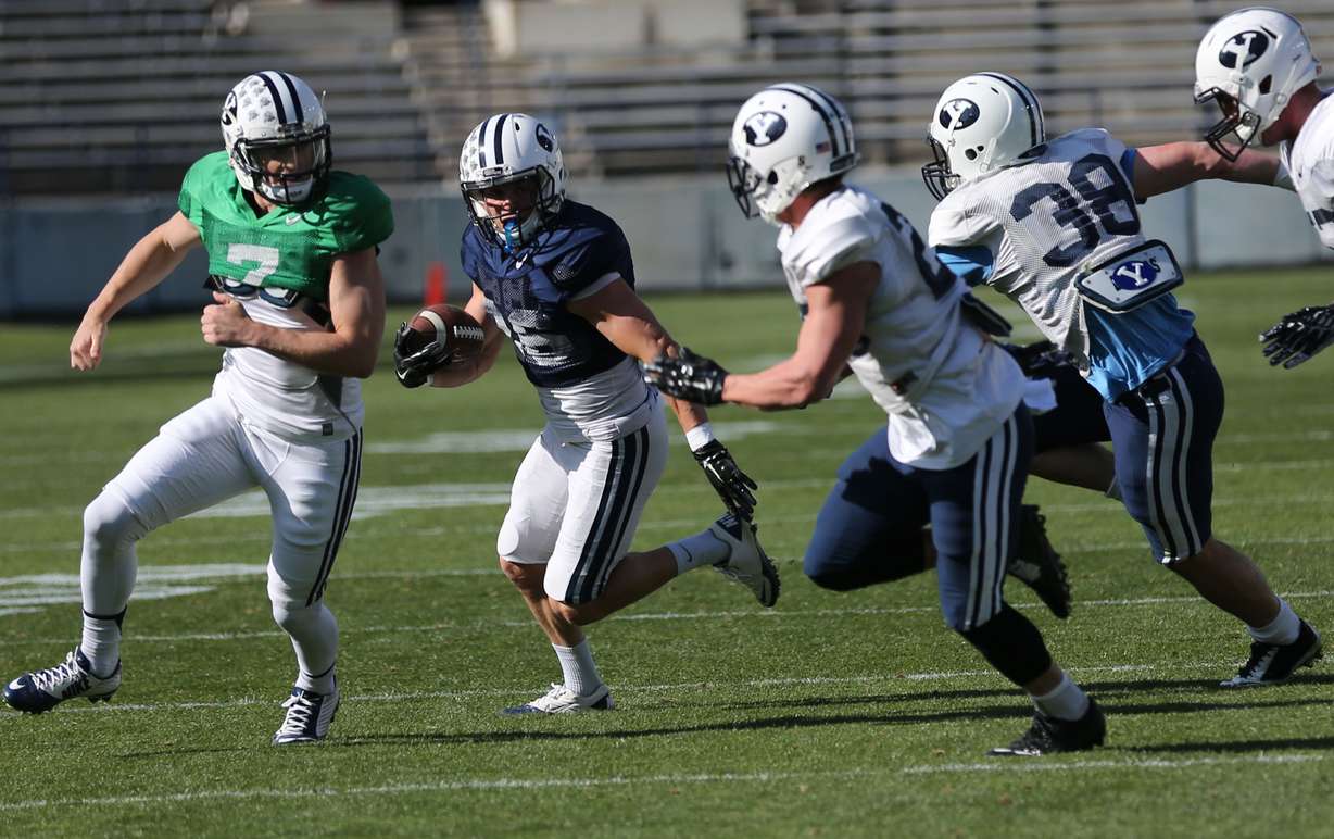 Nate Carter runs with the ball during BYU spring football practice at LaVell Edwards Stadium in Provo on April 3, 2015. (Photo: Kristin Murphy/Deseret News)