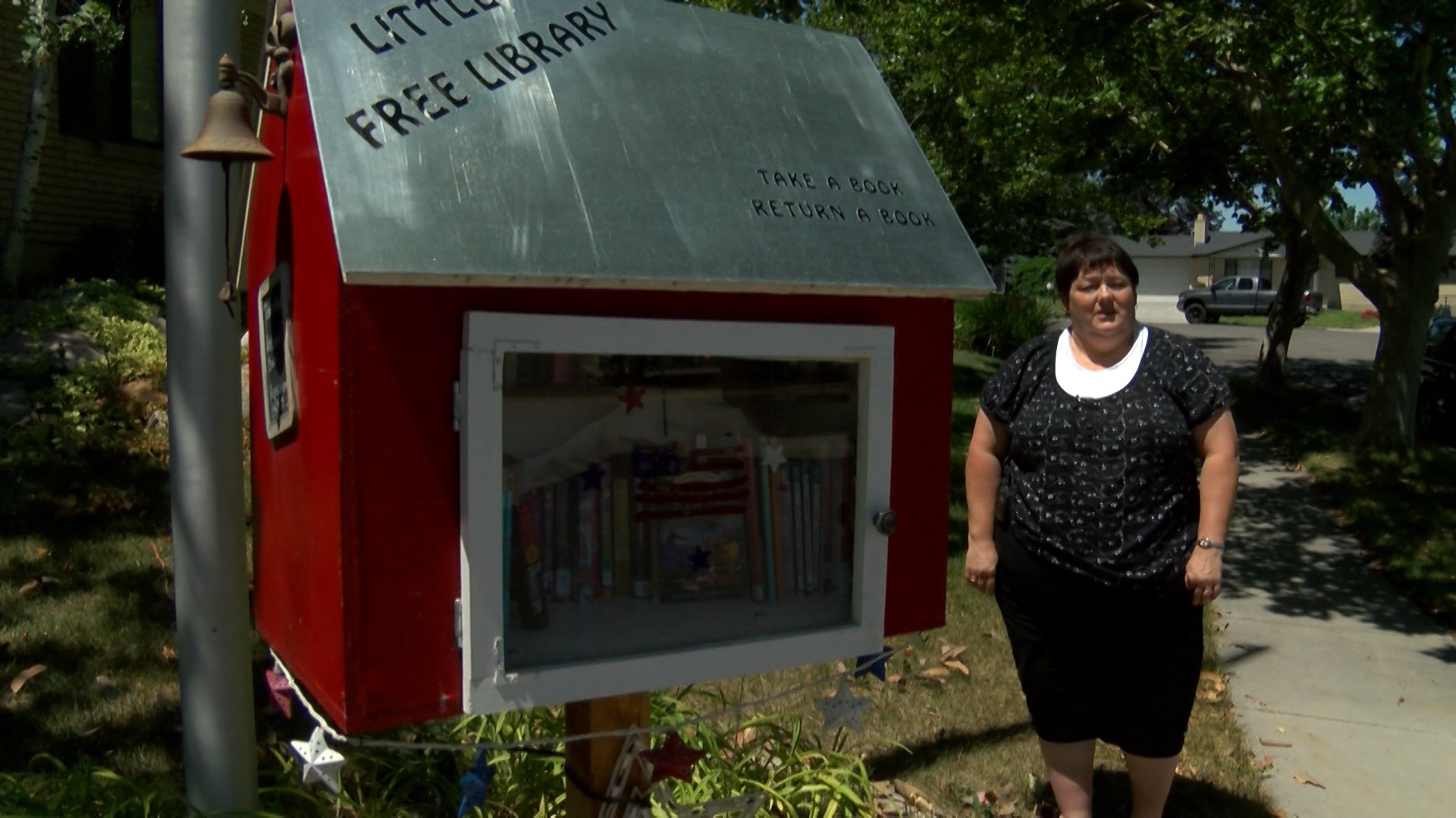 Susan Gustafson and her Little Free Library