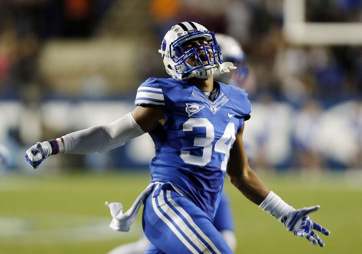 Fred Warner (34) of the Brigham Young University Cougars celebrates what he thought was a successful on side kick against USU during NCAA football in Provo, Friday, Oct. 3, 2014.(Ravell Call/Deseret News)