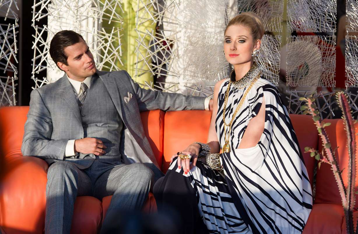 This photo provided by Warner Bros. Pictures shows, Henry Cavill, left, as Napoleon Solo, and Elizabeth Debicki as Victoria in Warner Bros. Pictures' action adventure "The Man from U.N.C.L.E.," a Warner Bros. Pictures release. The movie opens Aug. 14, 2015. (Daniel Smith/Warner Bros. Pictures via AP)