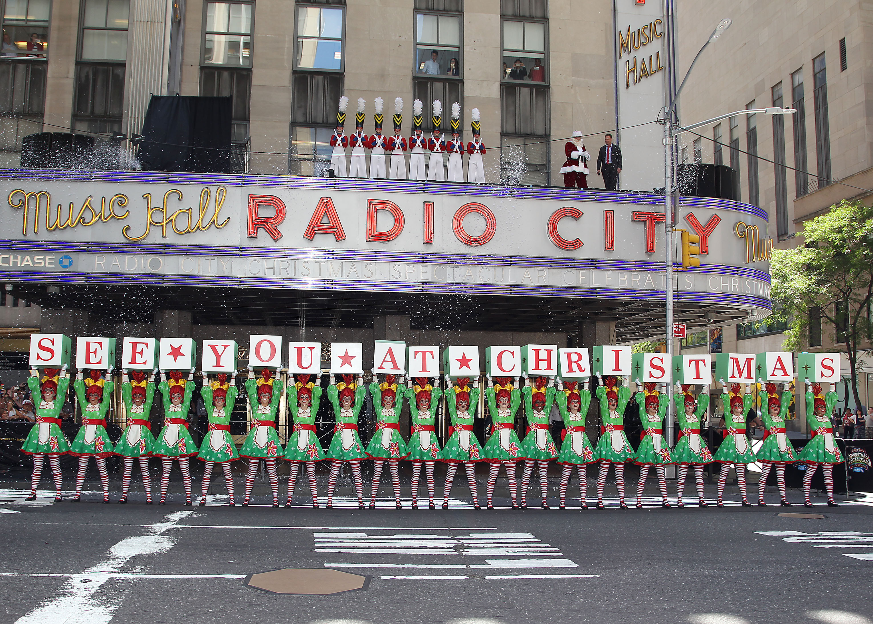 Santa Claus and Rockettes stop NYC traffic to publicize show