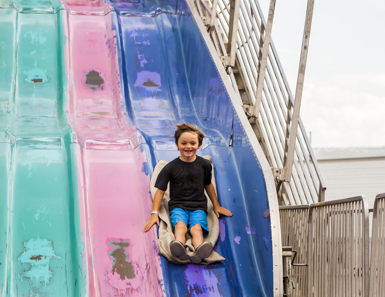 Kyle Butler, 5, races down a slide at the 79th-annual Salt Lake County Fair in South Jordan on Saturday, Aug. 15, 2015. (Photo: Stacie Scott, Deseret News)