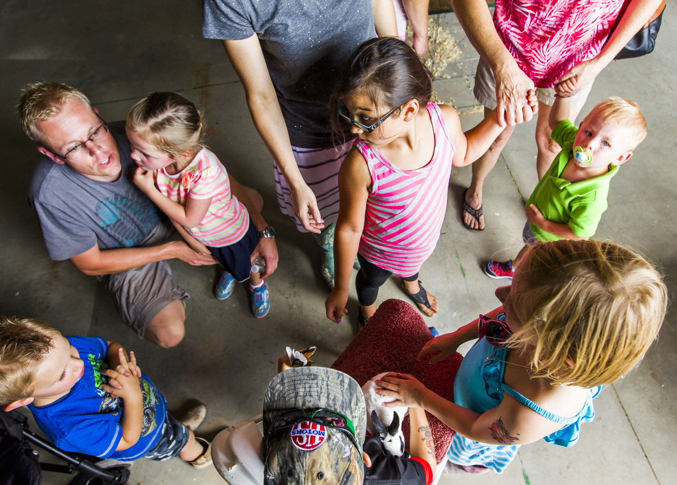 Children crowd around to pet a bunny at the Salt Lake County Fair in South Jordan on Saturday, Aug. 15, 2015. (Photo: Stacie Scott, Deseret News)