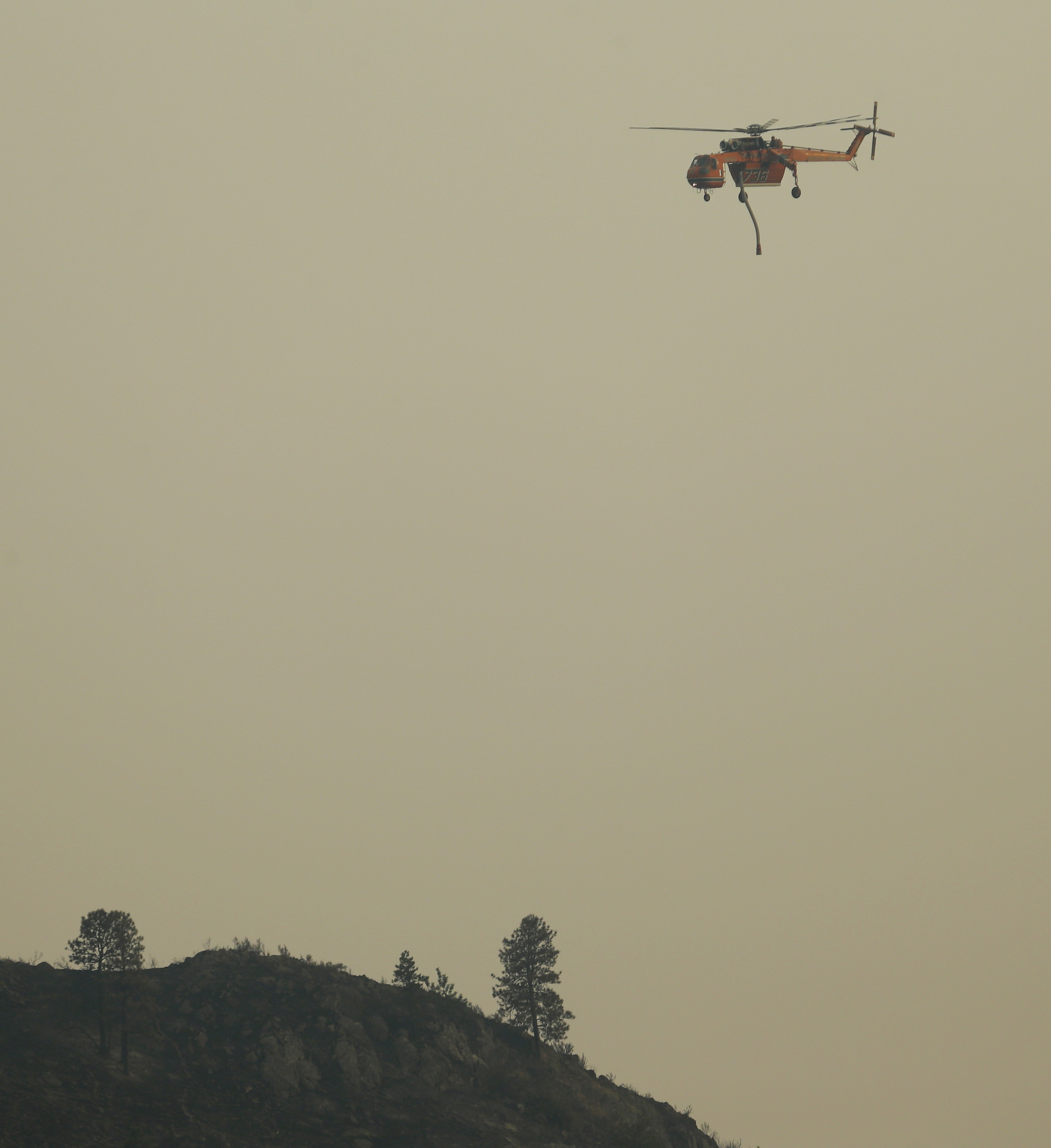 Massive blazes across dry West drain firefighting resources