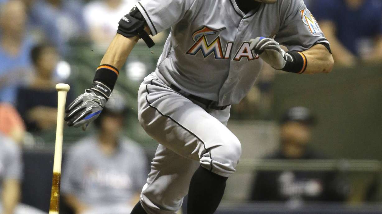 Suzuki's 4 hits lift Marlins past Brewers 9-6