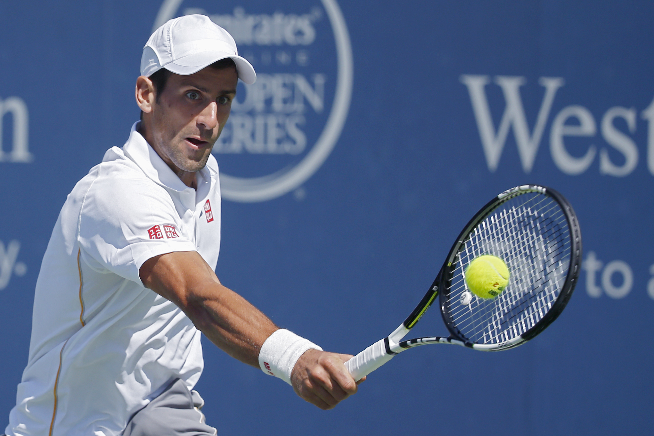 Djokovic romps to straight-sets win over Wawrinka