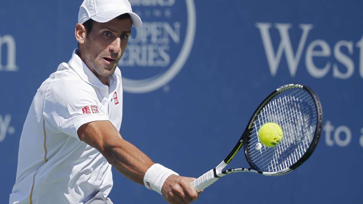 Djokovic romps to straight-sets win over Wawrinka