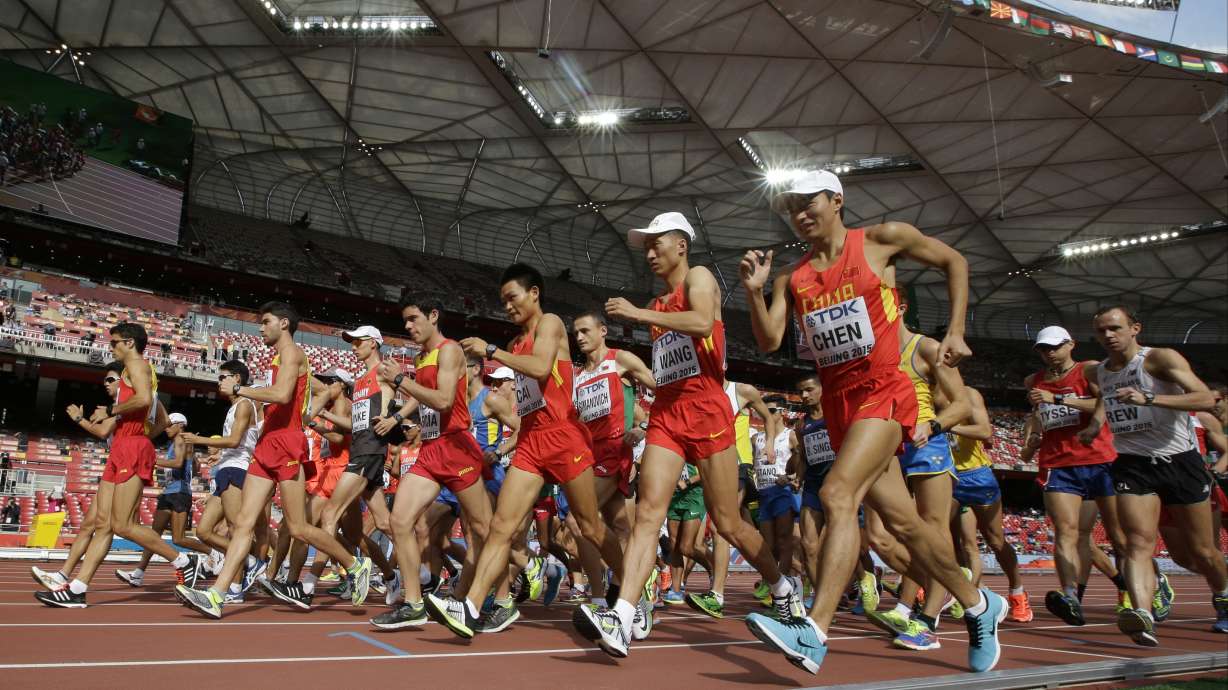 The Latest: Su makes some history in the 100 at worlds