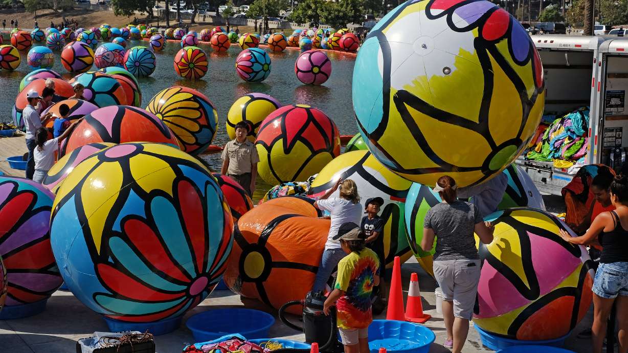 3,000 balls float on Los Angeles lake as part of art project