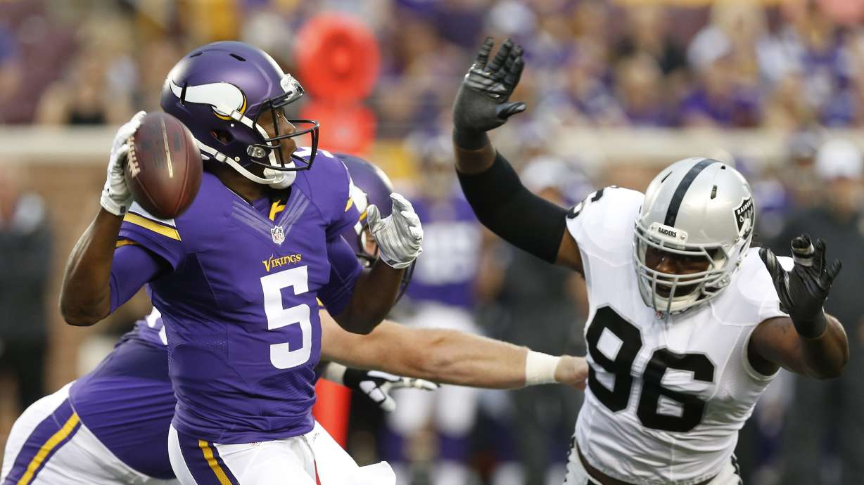 Vikings rally after storm delay, top Raiders 20-12