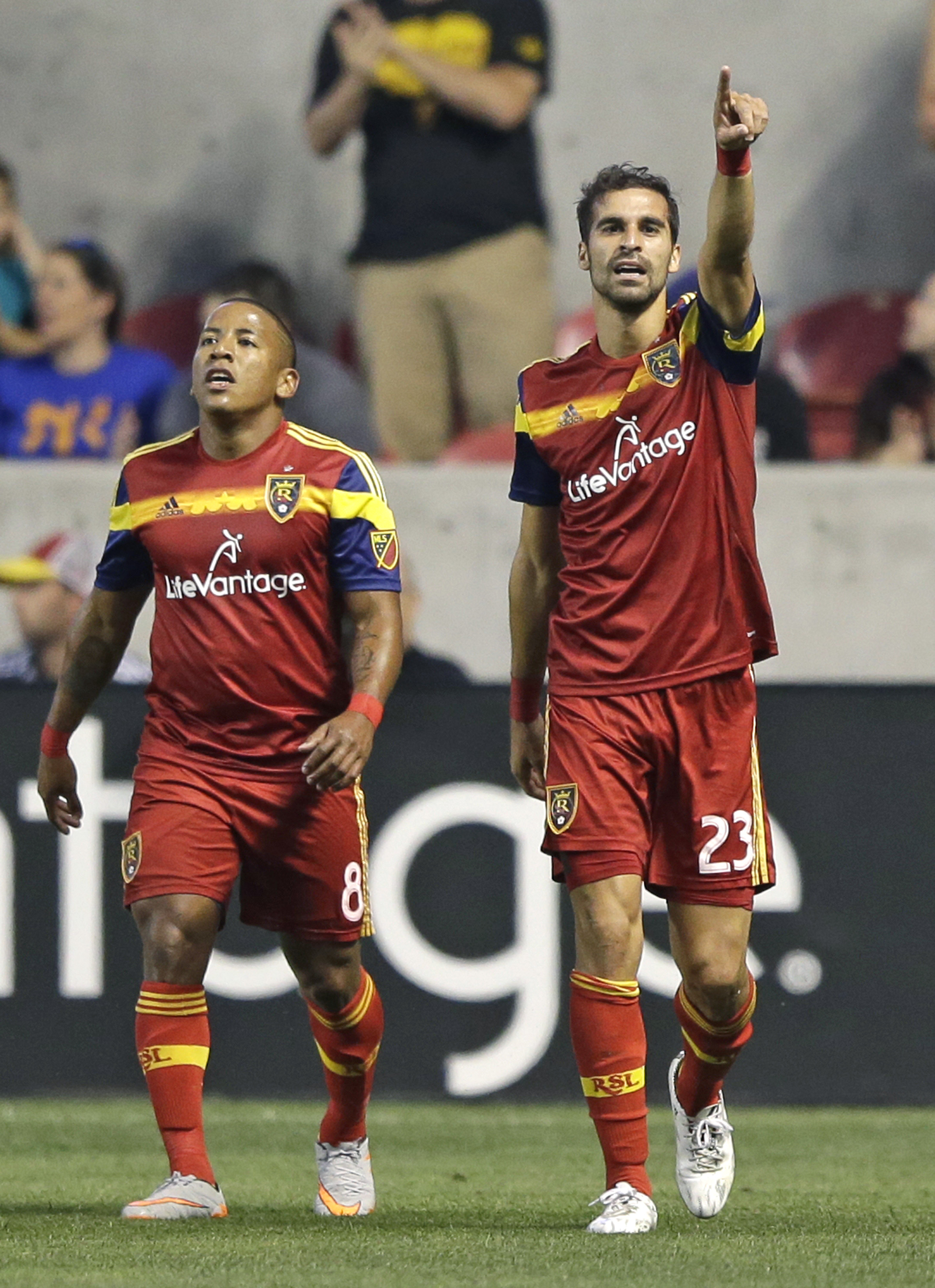 Real Salt Lake's Sebastian Jaime (23) celebrates as he walks with forward Joao Plata (8) after scoring against the Seattle Sounders during the first half a match Aug. 22, 2015, in Sandy, Utah. (AP Photo/Rick Bowmer)