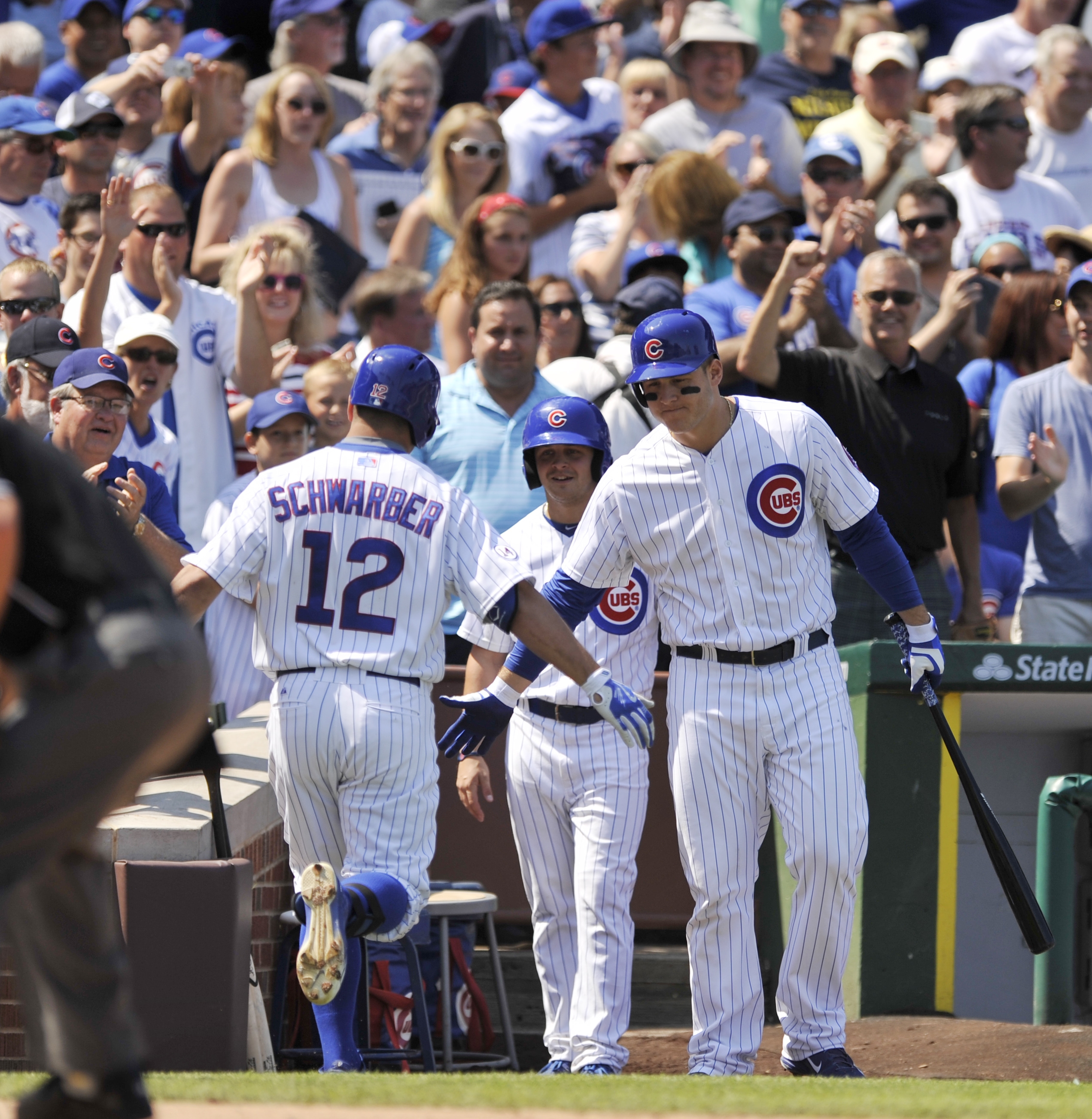 Bryant 2 HRs, fan hurt as Cubs hand Braves 7th straight loss